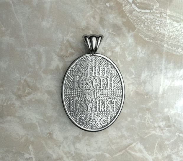 Saints of Christ Orthodox Icon Jewelry – Ovale (Oval - Shaped) pendant of the Saint Joseph the Hesychast in silver or white gold. (Back Side)