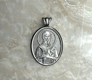 Saints of Christ Orthodox Icon Jewelry – Ovale (Oval- Shaped) pendant of the Saint Anthony the Great in silver, white gold, or rhodium plated brass. (Front Side)