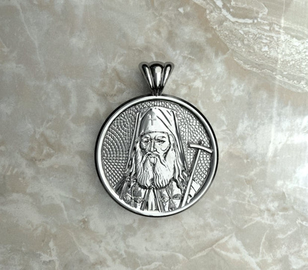 Saints of Christ Orthodox Icon Jewelry – Halo (Circle - Shaped) pendant of the Saint Luke the Surgeon in sterling silver, white gold, or plated rhodium. (Front Side)