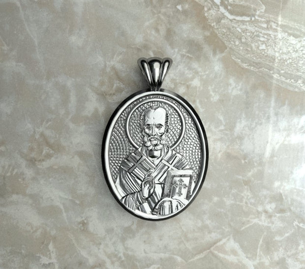 Saints of Christ Orthodox Icon Jewelry – Ovale (Oval - Shaped) pendant of the Saint Nicholas of Myra in silver or white gold. (Front Side)
