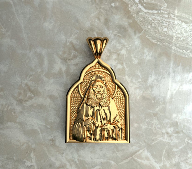 Saints of Christ Orthodox Icon Jewelry – Basilica (pointed Dome - Shaped) pendant of the Saint Joseph the Hesychast in yellow gold or plated yellow gold. (Front Side)