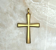 Yellow gold or yellow gold plated basic beveled Latin cross.